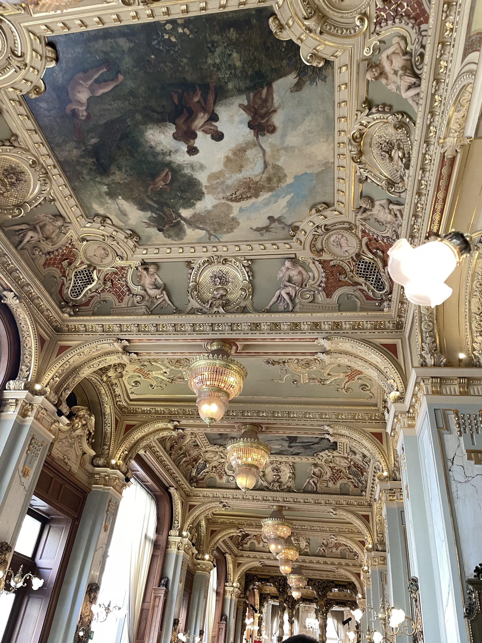 Ornate painted ceiling and gold baroque interior in Budapest
