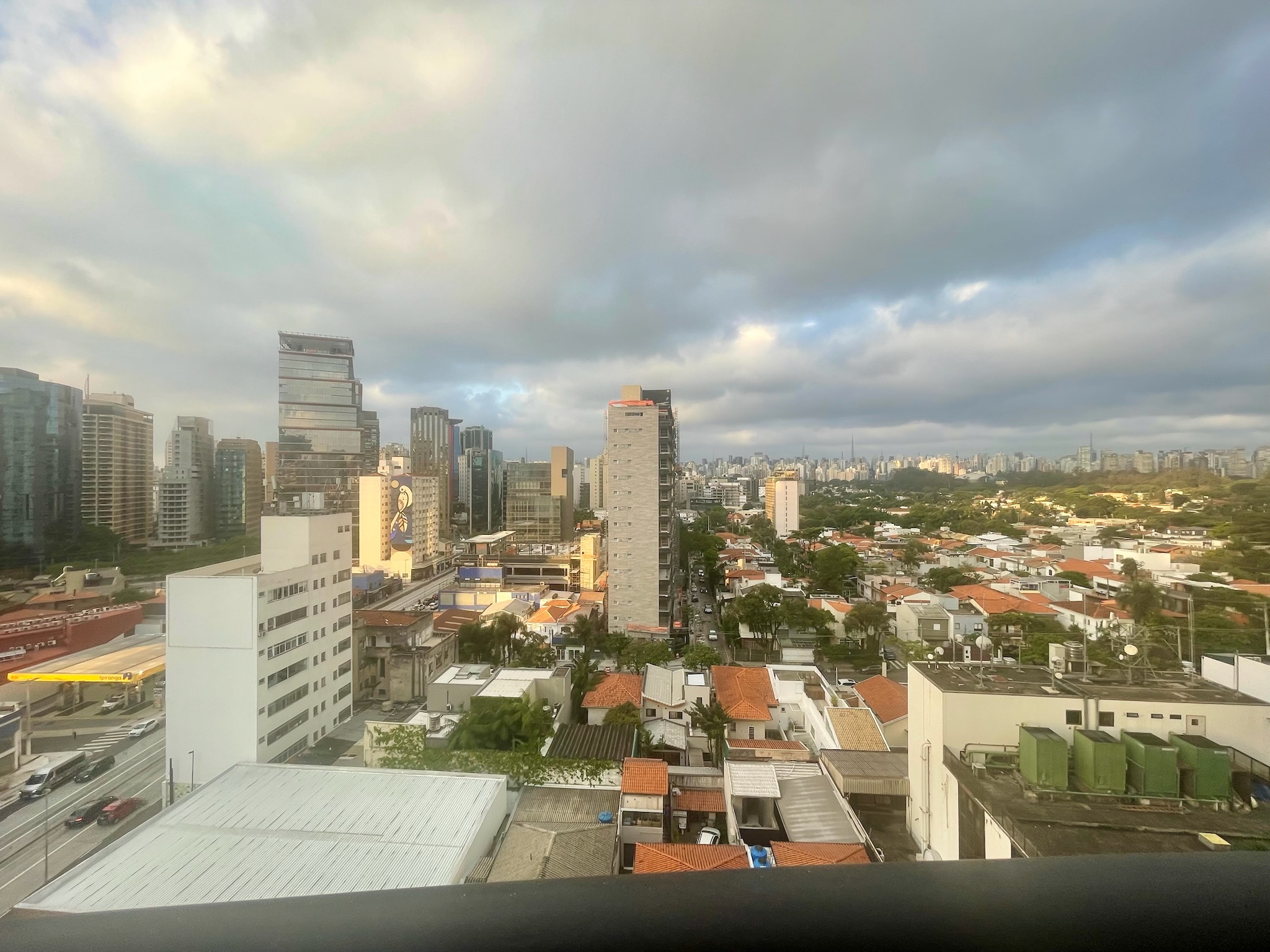 Sao Paulo city skyline panorama with dramatic clouds viewed from hotel rooftop