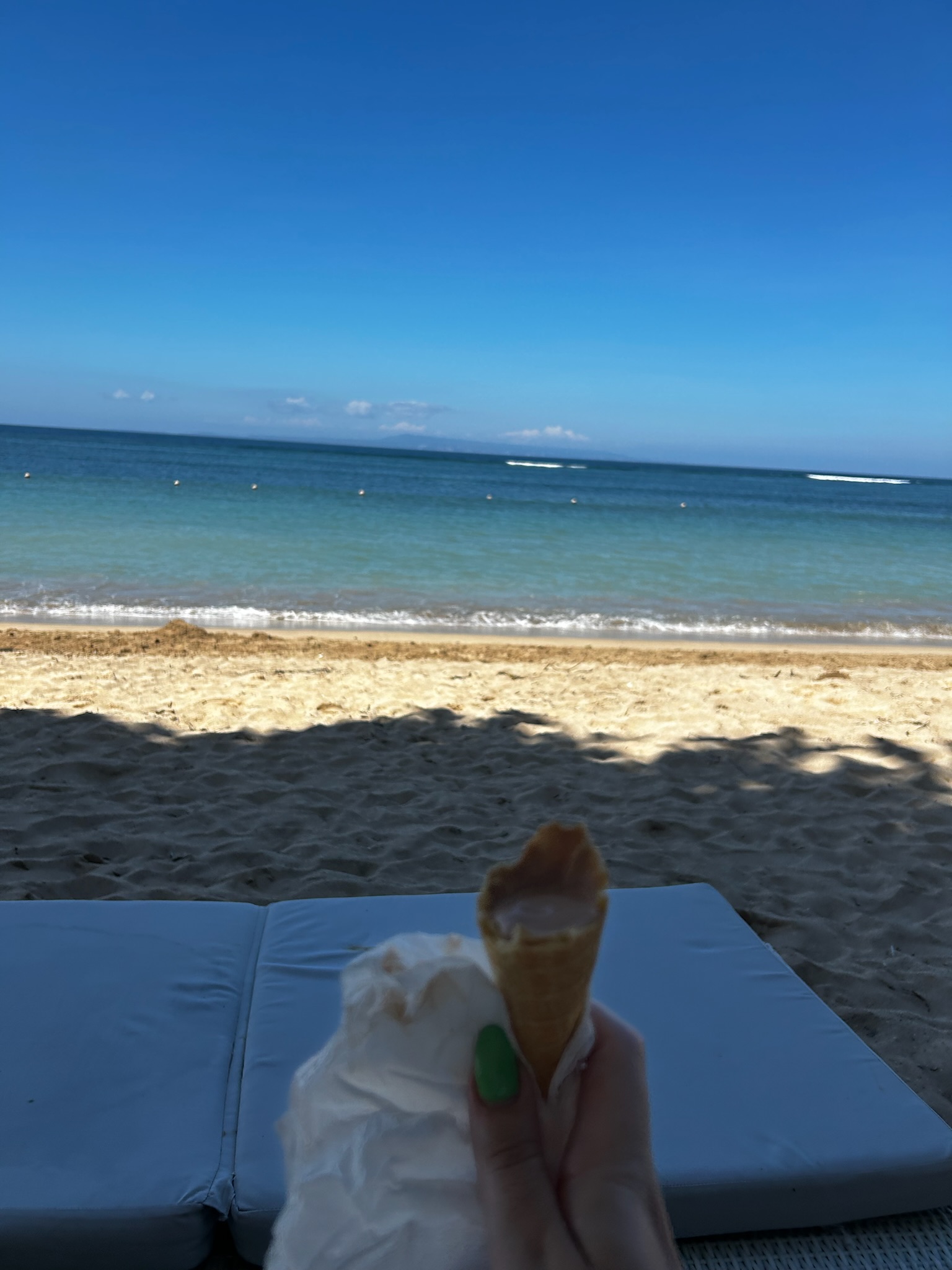 Scuba diver exploring colorful coral reef in Bali waters