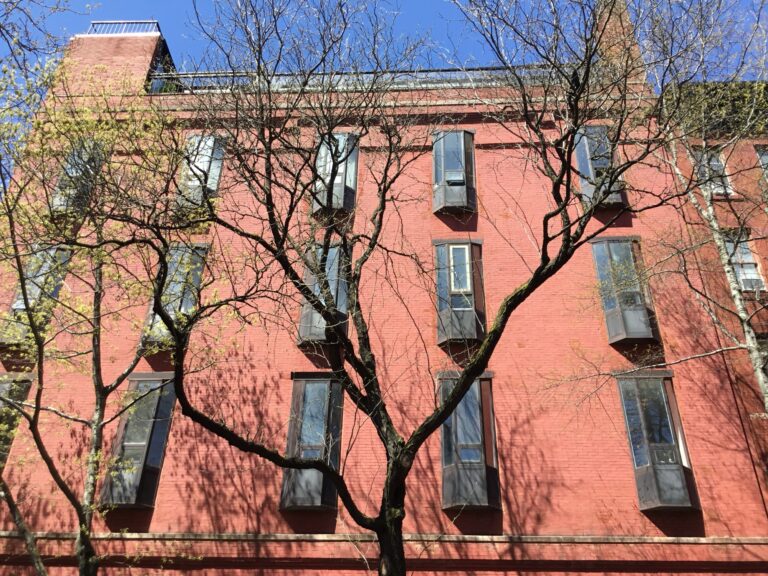 West Village block with townhouses and mature trees.