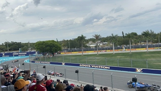 Miami 2025 &mdash; F1 cars stream past the Louis Vuitton barriers, the afternoon Oscar Piastri won.