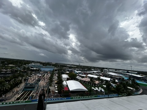 The other side of a Miami afternoon: storm clouds rolling over the circuit infield from the upper deck.